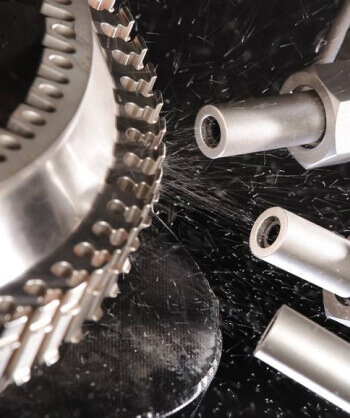 http://Three%20nozzles%20spraying%20shot%20at%20the%20teeth%20of%20a%20gear.%20Shot%20is%20ricocheting%20away%20from%20the%20gear.