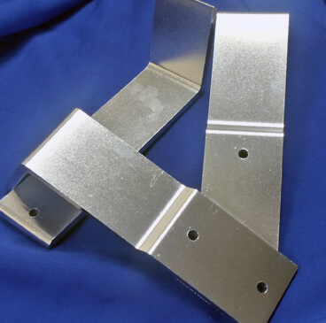 http://Three%20polished,%20angular%20brackets%20showing%20the%20results%20of%20Eaglemaster's%20steel%20ball%20burnishing.