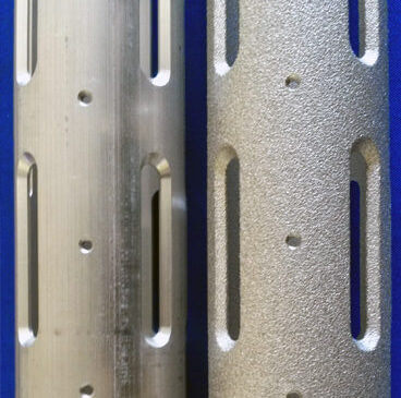 http://Side%20by%20side%20image%20of%20two%20identical%20parts%20showing%20the%20before%20&%20after%20results%20of%20bead%20grit%20blasting.