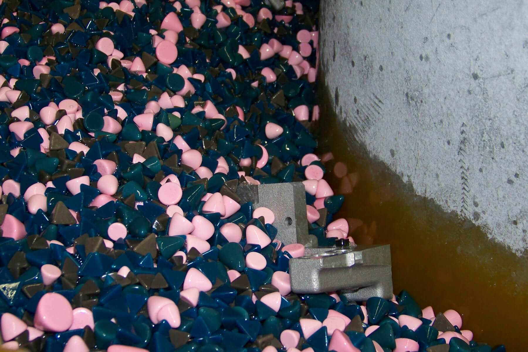 A large number of parts being finished using Eaglemaster's vibratory finishing method.